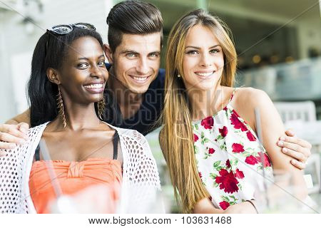 Happy Young Friends Smiling Outdoors Being Close To Each Other