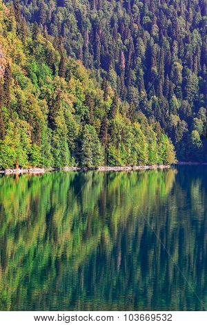 Scenery view of colorful mountain lake with crystal water and beautful reflections Ritsa lake Abkhazia