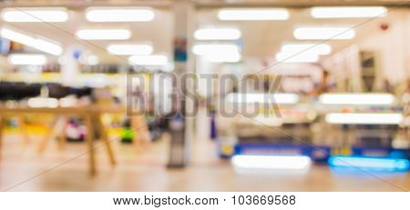 Blur Image Of Eletronic Department Store With Bokeh