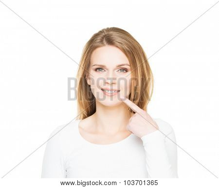 Attractive teenage girl smiling in teeth retainer. Stomatology concept.