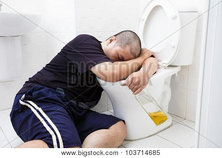 Drunk Fat Man With Wine Bottle In Toilet