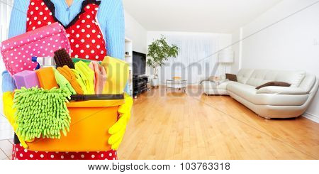 Maid hands with cleaning tools. House cleaning service concept.