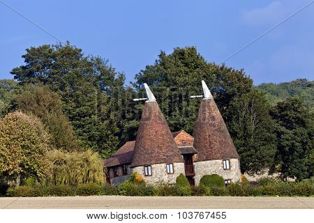 Old traditional Kentish round stone oast house