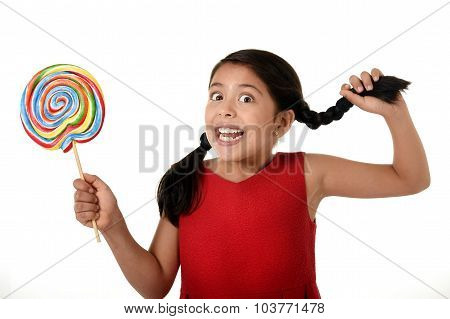 Happy Female Child Holding Big Lollipop Candy Pulling Pony Tail With Crazy Funny Face Expression