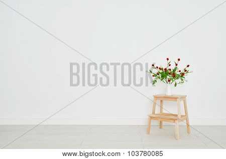 Concept Of  Bouquet Of Flowers On  Stepladder On Background White Brick Wall In An Empty Room