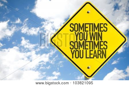 Sometimes You Win Sometimes You Learn sign with sky background