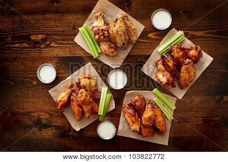 to pdown view of chicken wing party platter made to share with four different flavors and ranch dipping sauce