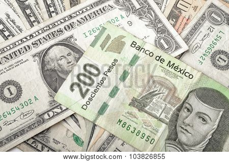 Dollar and Mexican Peso Bills