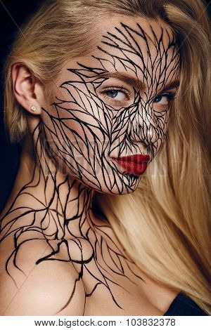 fashion portrait of girl with faceart
