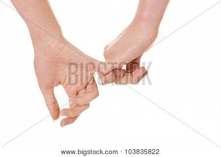 Woman's and man's hands together.