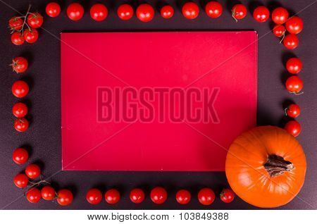 Fresh vegetables on a black table. Autumn background.
