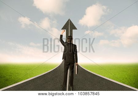 Businessman lokking at 3d road upgoing arrow concept