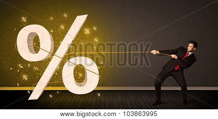 Business man pulling rope with big procent symbol sign concept on background
