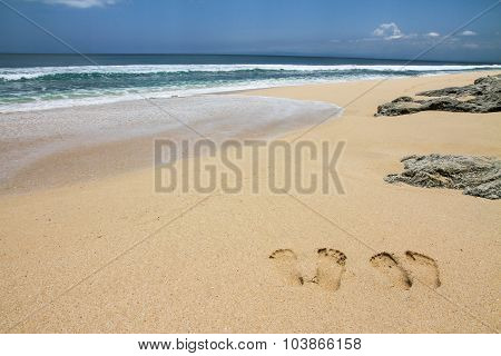 Beach With Footsteps And Stones-bali,indonesia