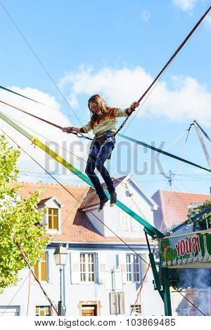 Teenage Girl Jumping With Bungie