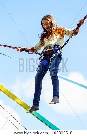 Teenage Girl Jumping With Bungie