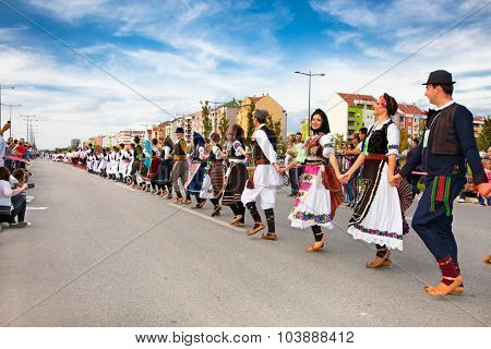 NOVI SAD, SERBIA-OCT 4, 2015: Guinness World Record Largest Folk Dance on Oct 4. 2015 in Novi Sad, Serbia. Over 12.000 participants break the Guinness World Record by simultaneously dancing a Kolo