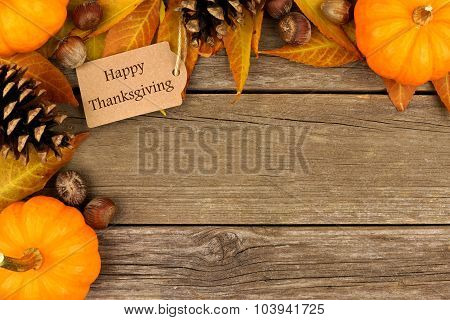 Happy Thanksgiving gift tag with autumn corner border over wood