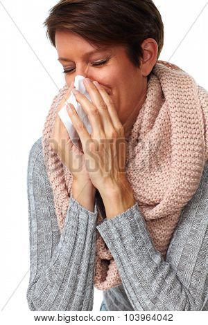 Woman with facial tissue having rheum. Health care.