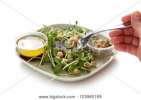 Microgreens salad with green fresh shoots. Health and diet.