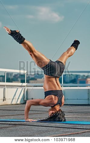 Woman doing yoga headstand