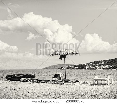 View from the Pantan beach in Trogir to the Ciovo island Croatia. Summer vacation. Destination scenic. Black and white photo.