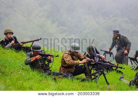 Soldiers with machine guns.The VIII International Festival of Military History and remake for the battle `1944` 6.08.2016 in Valga, Estonia