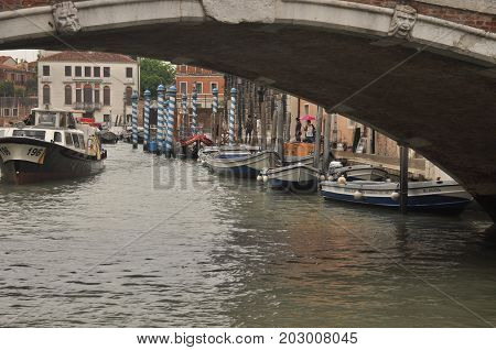Narrow canals and alleyways in Venice. City of monuments in gondola.