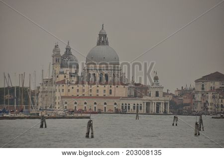 Narrow canals and alleyways in Venice. City of monuments in gondola.