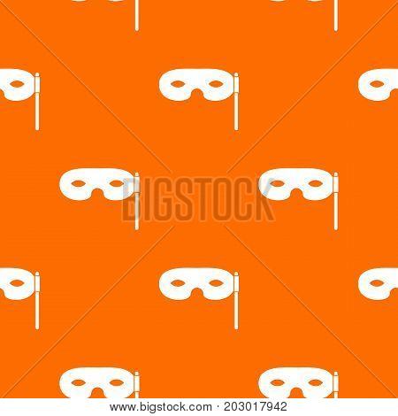 Carnival mask pattern repeat seamless in orange color for any design. Vector geometric illustration