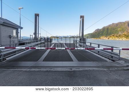 Empty Ferry Terminal With Metal Ramp And Cosed Turnpike.  Norway.