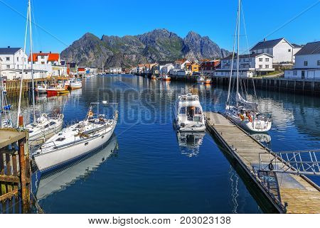 Scenic View Of The Waterfront Harbor In Henningsvaer In Summer