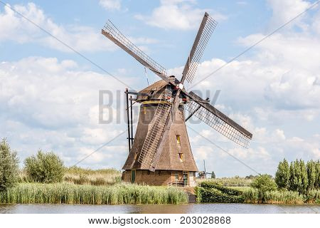 Landscape view on the old windmill in Kinderdijk village in Netherlands