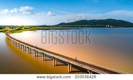 Aerial Photo Railway Curve Track to the mountains is located on the River Pasak River DamLopburi Thailand