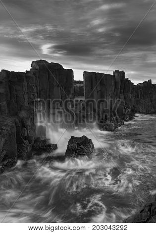 Landscape of Basalt rock formations with a view to the sea at Bombo Headland quarry New South Wales Australia