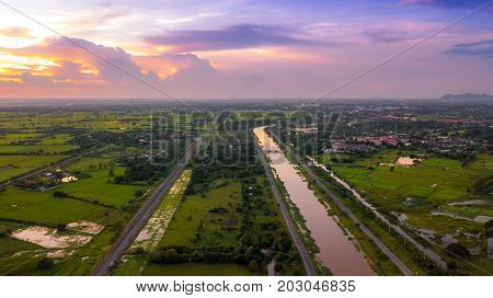Aerial Photo canal and Railway Countryside Green Field Beautiful Sky Lopburi Thailand