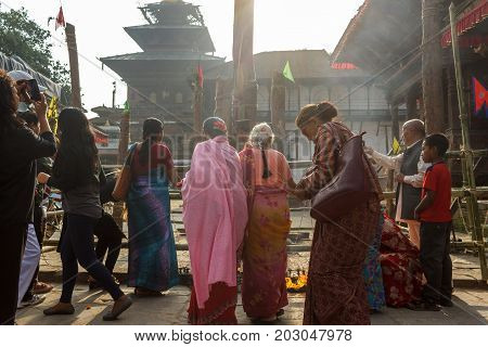 KATHMANDU NEPAL - 9/26/2015: Devotees gather at Durbar Square during the Indra Jatra festival in Kathmandu Nepal.