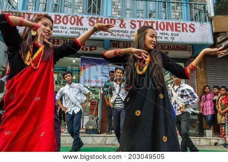 POKHARA NEPAL - 11/9/2015: A group of young Nepalese performers dance in traditional clothes during the Tihar festival in Pokhara Nepal.