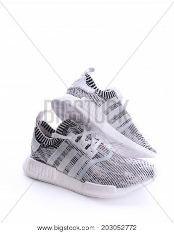 Kuala Lumpur, Malaysia - July 23, 2017: Rear view of Adidas NMD R1 Primeknit Oreo White Black Glitch Camo BY1911 sneaker on white background