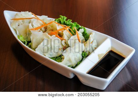 Veggie Potstickers, steamed vegetable dumplings with sweet soy sauce