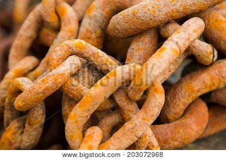 Old rusty heavy iron chain links, close-up