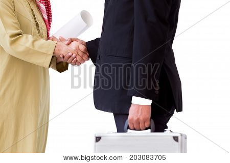 Arab Business Man Shake Hand With Asian Business Man In The Blakc Suit Carrying A Silver Suit Case.