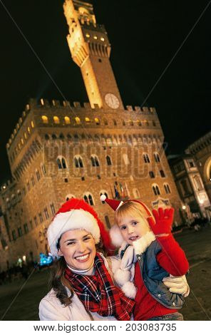 Mother And Daughter In Christmas Hats In Florence Handwaving