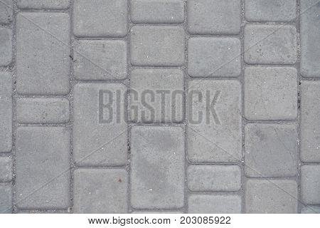 Dusty Grey Pavement Made Of Concrete Blocks