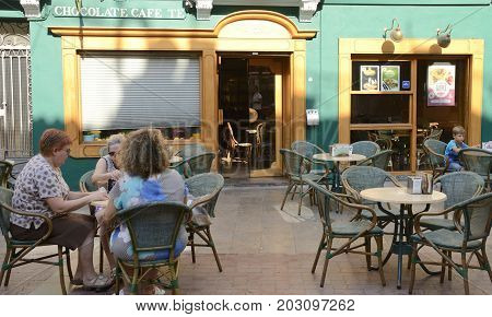 CASTELLON, SPAIN - JULY 22, 2017: People sitting at outdoors of a coffee shop in a central place of Castellon Valencian Community Spain.