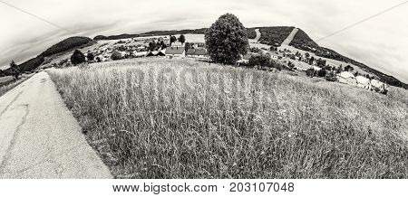 Panoramic photo of Cicmany village Slovak republic. Folklore theme. Rural landscape. Travel destination. Black and white photo.