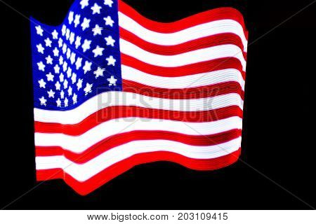 USA Flag lightpainted on black background texture