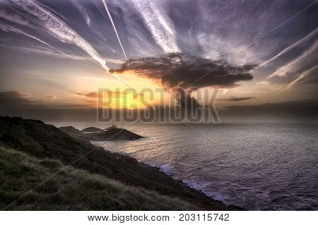 Sunrise, contrails and a mushroom type cloud