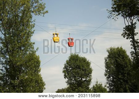 Cable car. A sublime road. A swing in motion in the daytime.
attraction on chains for adults
park exploration holidays