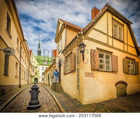 Medieval streets in old Riga, Latvia, Europe. In old Riga tourists can find unique medieval architectural ensembles and ancient buildings